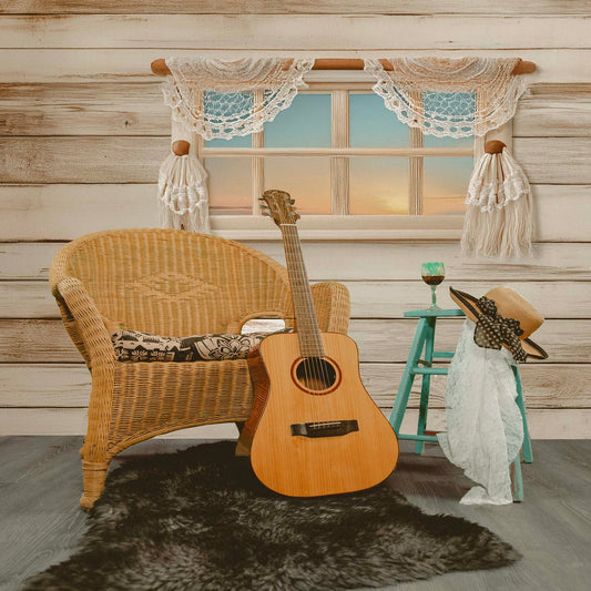 Boho Inspired Still Life with Acoustic Guitar, Wicker Chair, and Straw Hat